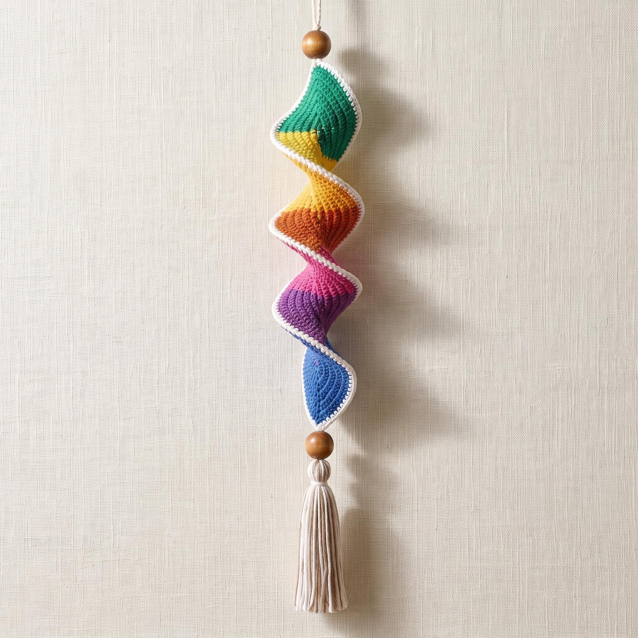 Colourful crochet wind spinner showing different yarn weights and colours